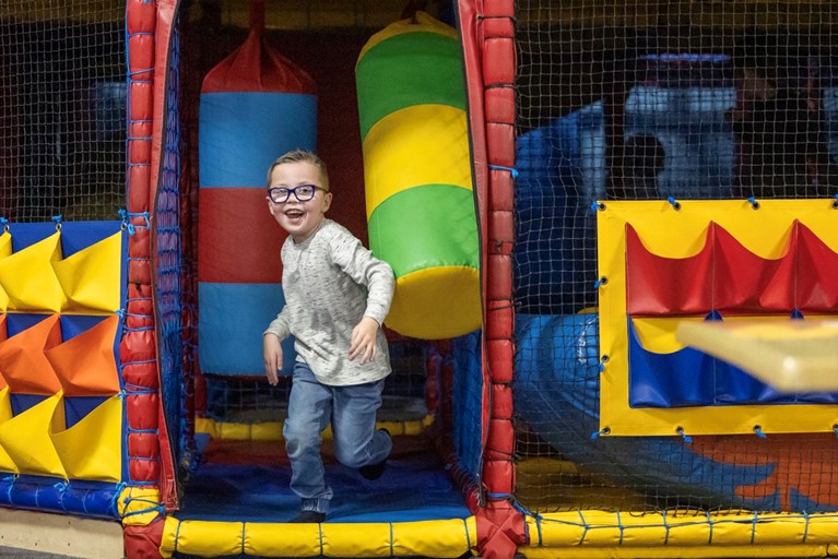 Child coming out of the soft play at Phoenix Bowl